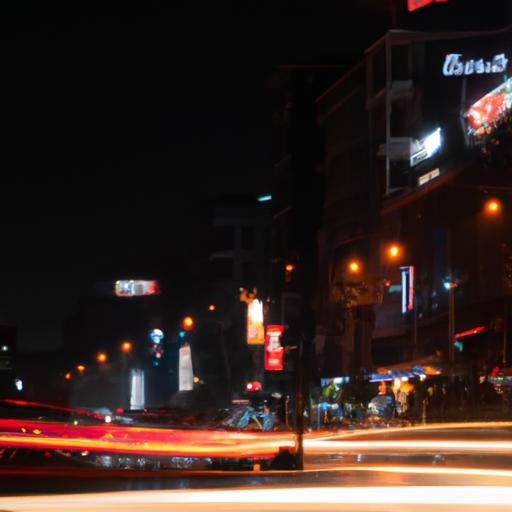 Cảnh đèn neon và phương tiện giao thông đêm trên con đường 23 Lê Lợi